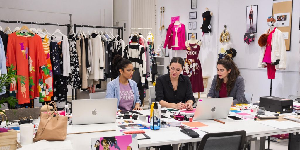 Fashion marketing professionals in a creative workspace.